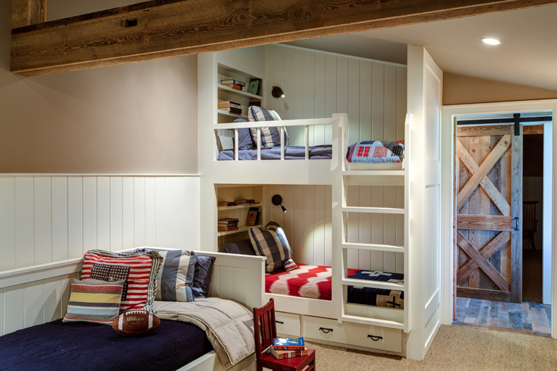 Built-in bunk bed with a trundle bed in the foreground.